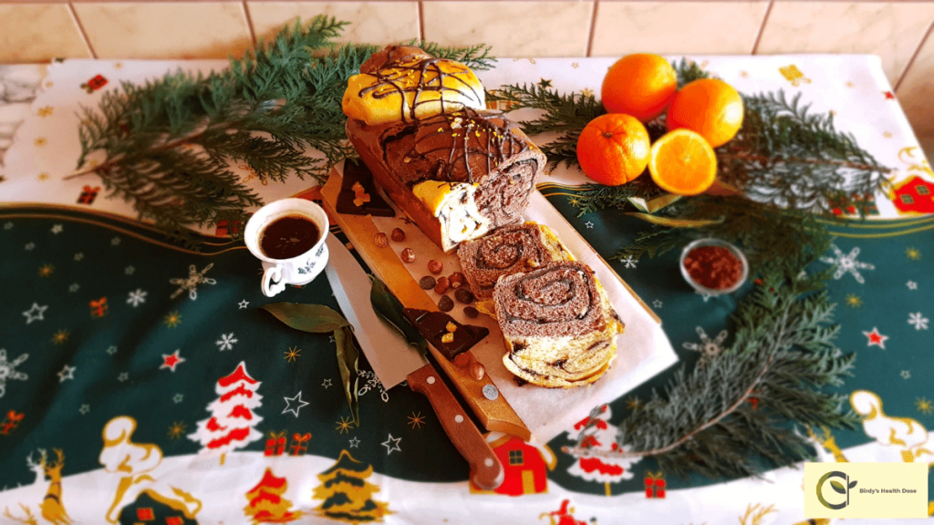 This dark chocolate, hazelnuts, candied oranges, cinnamon, and orange jelly traditional Romanian sweet bread is easily sliced and is extremely fluffy and fragile. In addition, it is extremely fragrant from the rum, cocoa, and orange and lemon zest, and simply melts in your mouth.